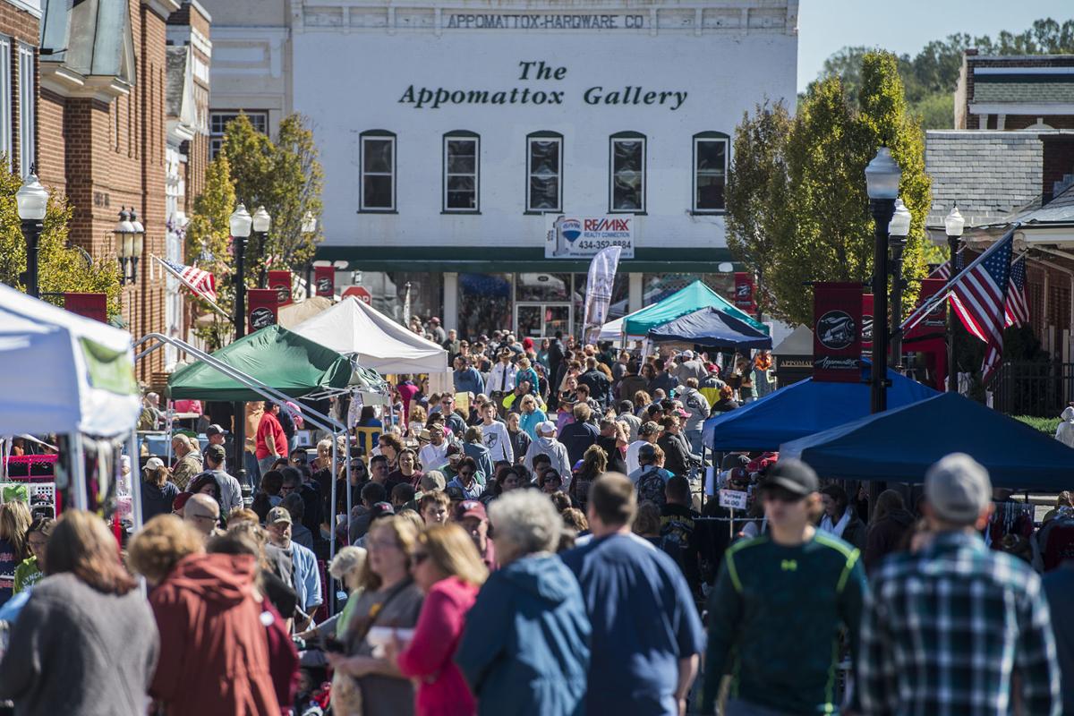 crowd of people walking through downtown at Appomattox Railroad Festival