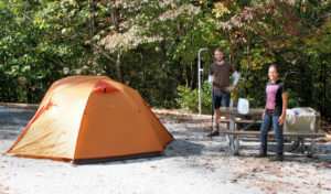 man and camping tent