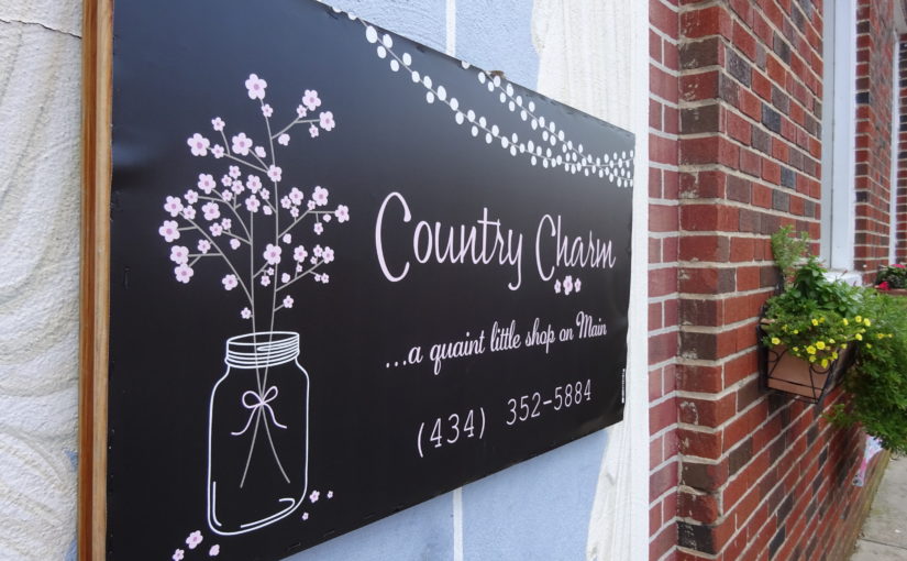 sign for country charm shop