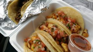 three tacos in to go container