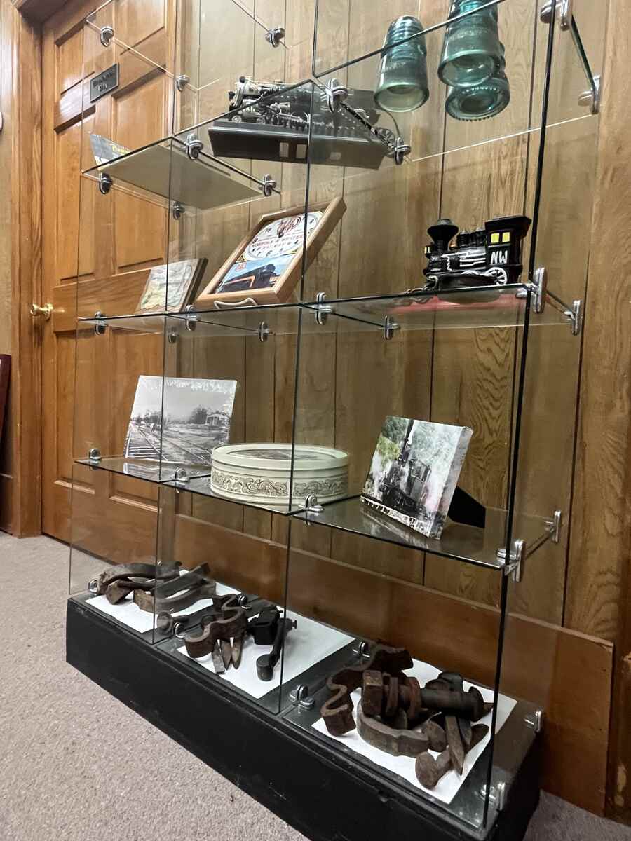 Glass shelves with train items on display