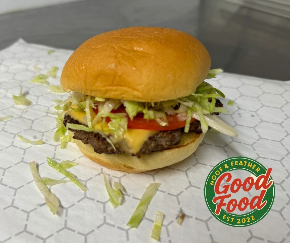 Burger on paper with Good Food logo