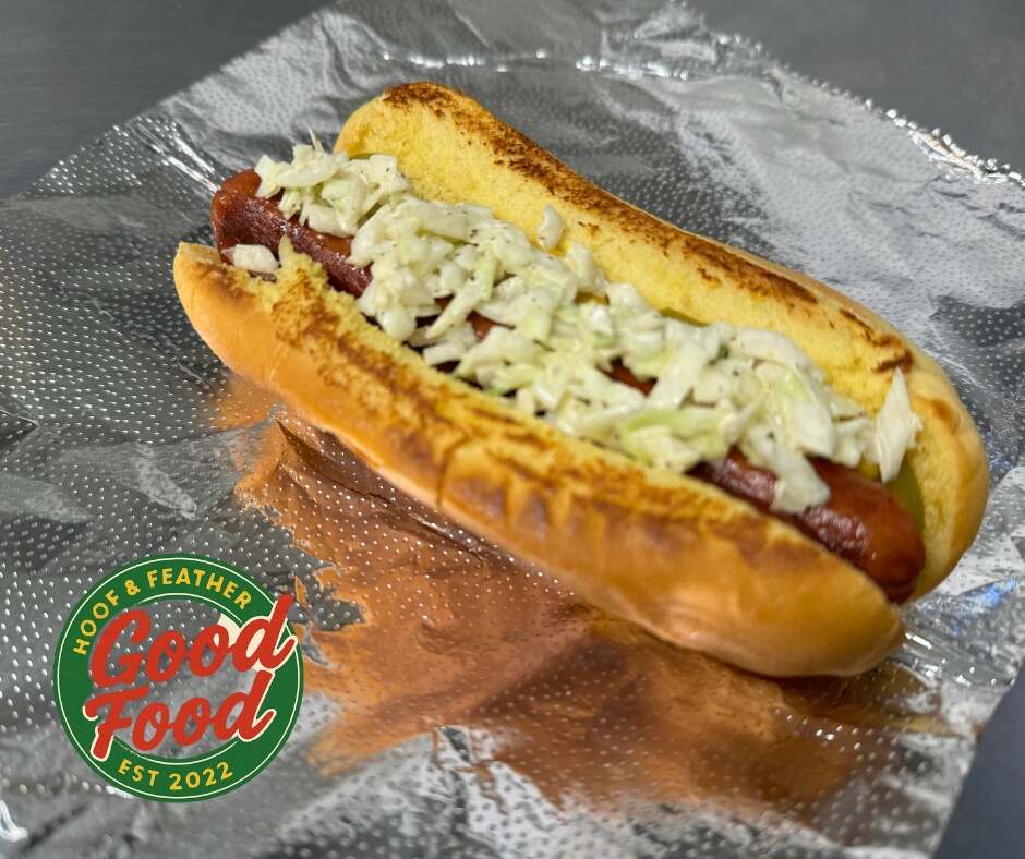 Hot dog on tinfoil with Good Food logo