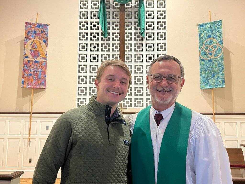Two men in church interior
