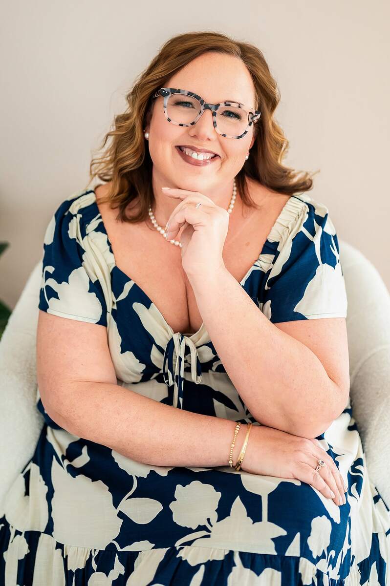 Woman in blue and white floral dress