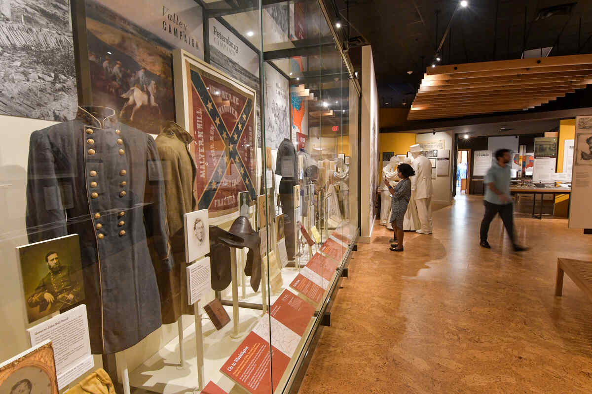 Display at the America Civil War Museum with uniform, saddle, and flag.
