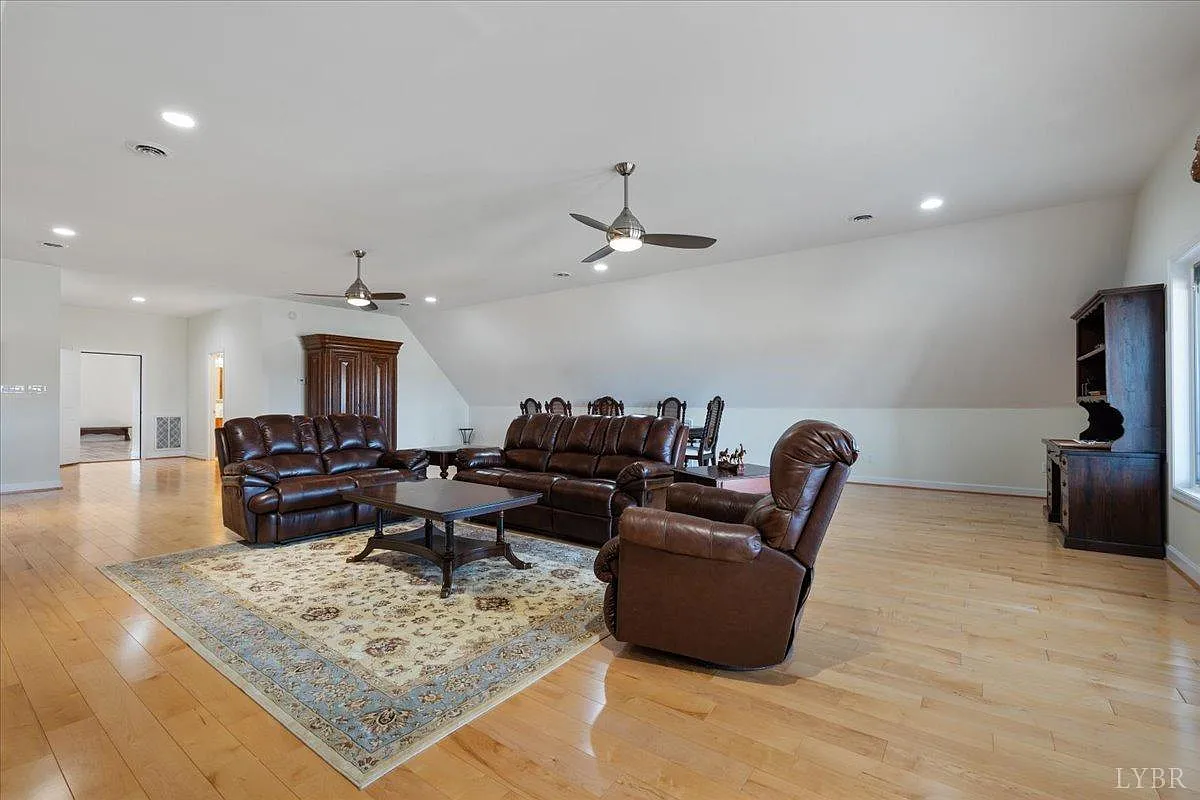 Room with wood floor and leather furniture