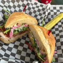 sandwich cut in half with pickle