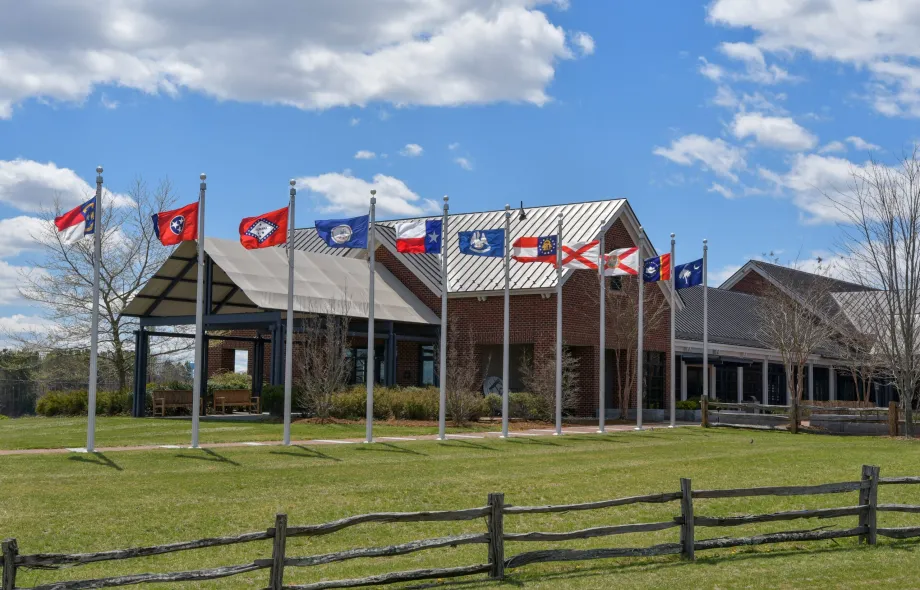 brick building with a line of flags