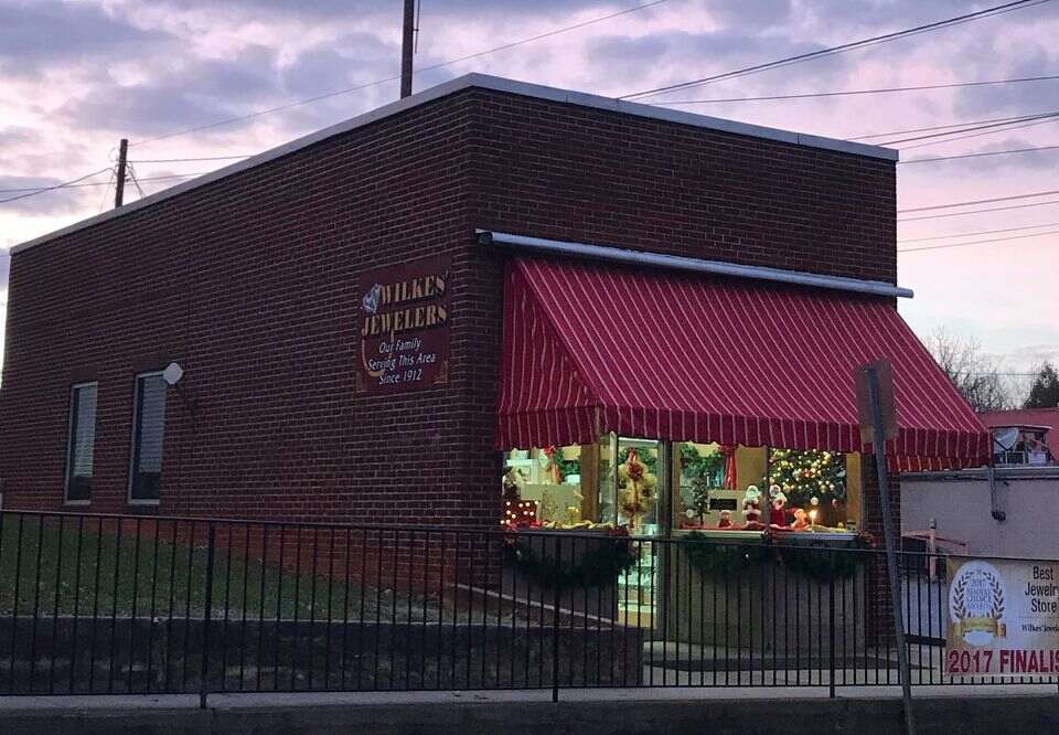 brick storefront with red awning